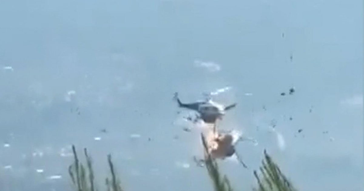 2 helicopters collide while putting out fires in Greece