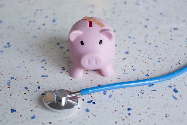 Piggy bank with band-aid