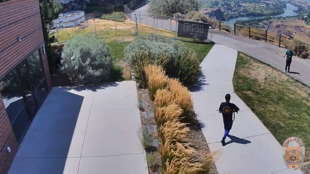 The gunman encounters a worker outside the Twin Falls Visitor Center in Idaho, Aug. 1, 2026. 