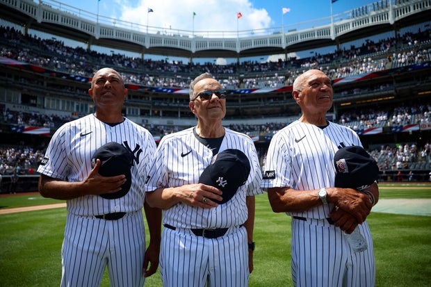 Mariano Rivera, Joe Torre and Reggie Jackson stand for the national anthem during the New York Yankees Old Timers' Day before the game against the Atlanta Braves at Yankee Stadium on August 8, 2026 in New York, New York.