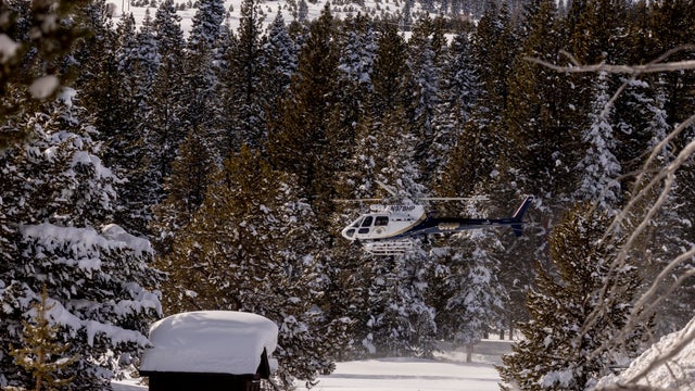 Rescue teams deploy to the site of an avalanche in a backcountry slope of California's Sierra Nevada mountains 