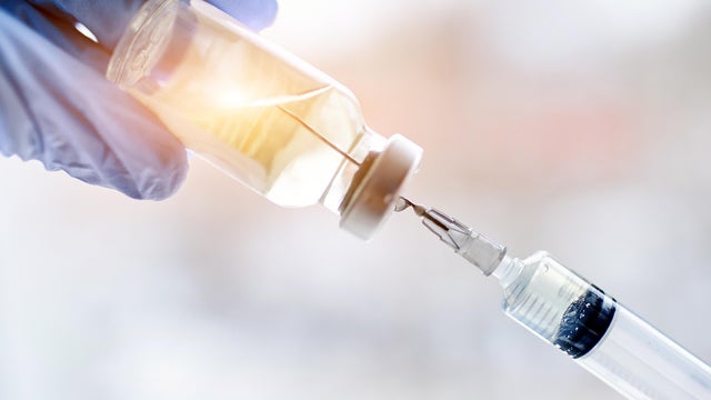 Magical vaccine vial dose flu shot drug needle syringe,medical concept vaccination hypodermic injection treatment disease care hospital prevention immunization illness disease baby child. 
