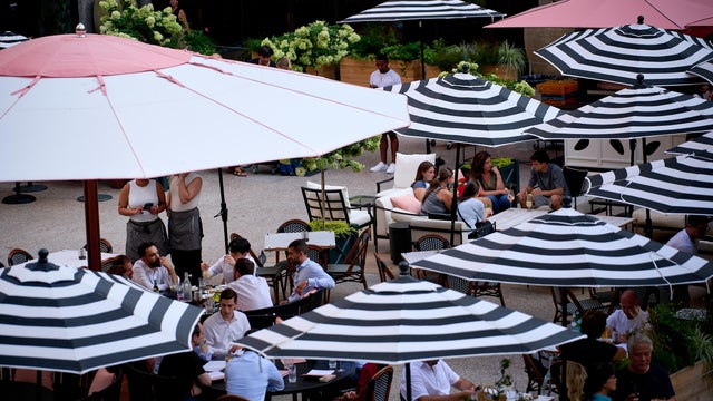 Two roadside dining structures on a New York City street. 