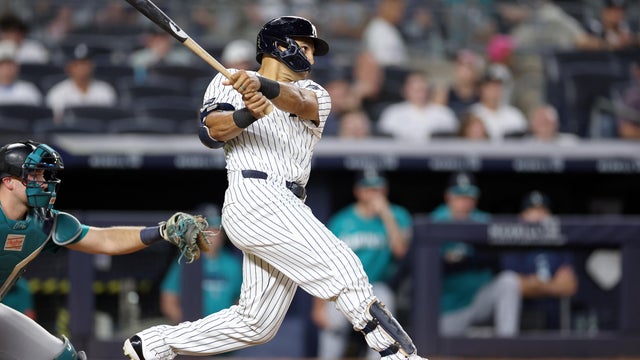 Trent Grisham #12 of the New York Yankees hits a two-run home run during the eighth inning against the Seattle Mariners at Yankee Stadium on August 12, 2026 in the Bronx borough of New York City. 