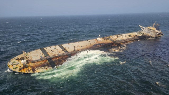 The damaged and half sunk oil tanker Caroline Bezengi, at sea off the coast of Oman 