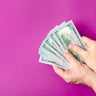 Hand holding dollars 