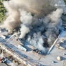 Firefighters work at the site of a shopping mall hit by Russian drone strikes in Kryvyi Rih, Ukraine, Aug. 21, 2026. 