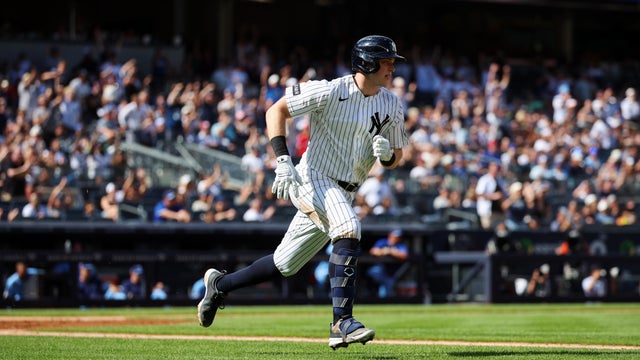 Ben Rice #22 of the New York Yankees hits a two-run single during the game against the Toronto Blue Jays at Yankee Stadium on August 23, 2026 in New York, New York. 