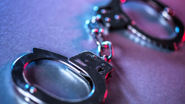 Close-up of metal handcuffs symbolizing justice and crime control 