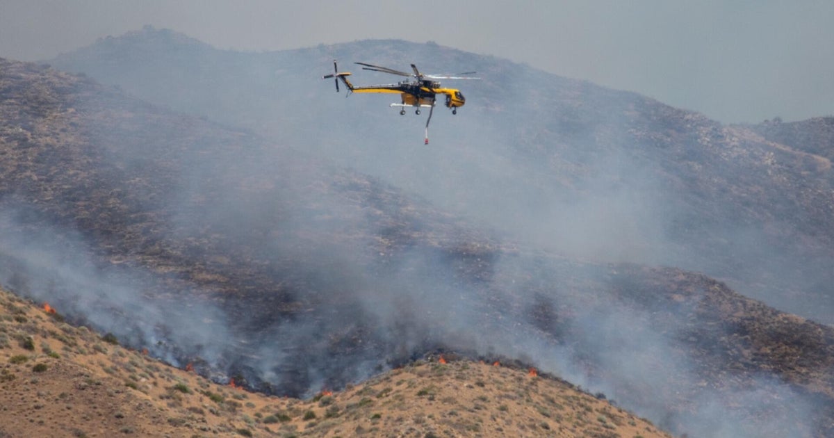 Fast-moving wildfire closes in on Reno, Nevada, forces evacuations