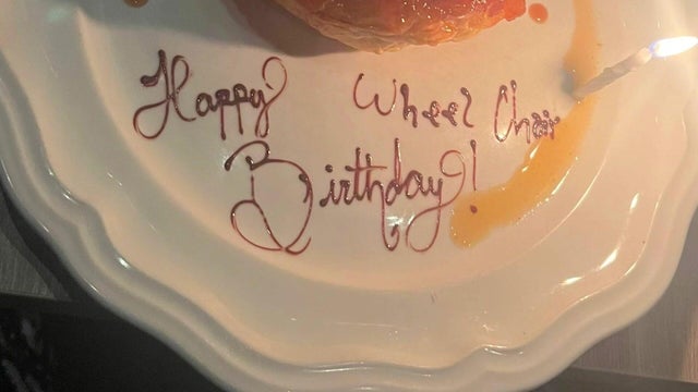 "Happy Wheel Chair Birthday!" written on a dessert plate 