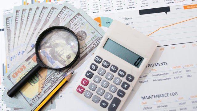 Money and magnifying glass,financial analysis 