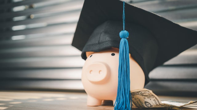 Black graduation hat and piggy bank concept investment in education Graduation save money for education 