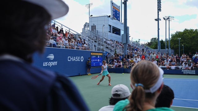Tennis fans watch as Anna Siskov&aacute;, of the Czech Republic, returns the ball during a qualifying match at the U.S. Open tennis championships, Tuesday, Aug. 25, 2026, in New York. 