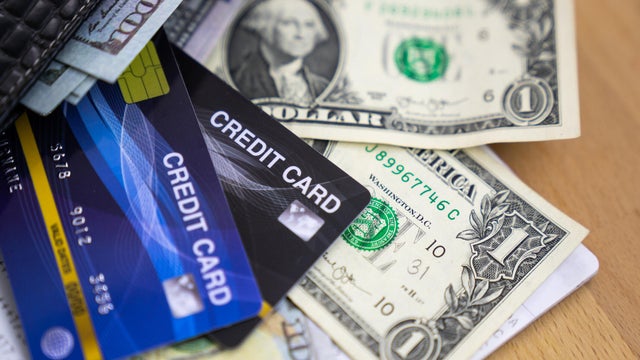 credit card and money, credit card putted on dollars. 