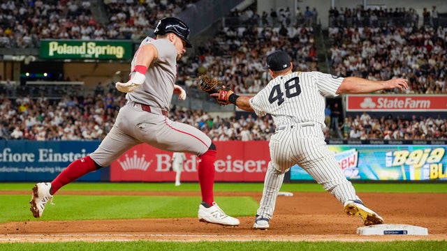 First baseman Paul Goldschmidt #48 of the New York Yankees gets third baseman Caleb Durbin #5 of the Boston Red Sox out in the eight inning at Yankee Stadium on August 28, 2026 in New York City. 