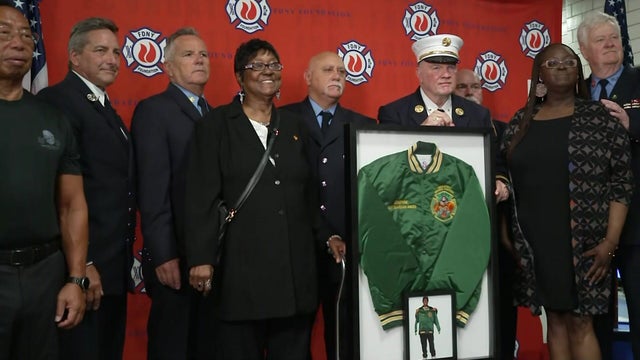 Firefighters and Josephine Harris' family members 