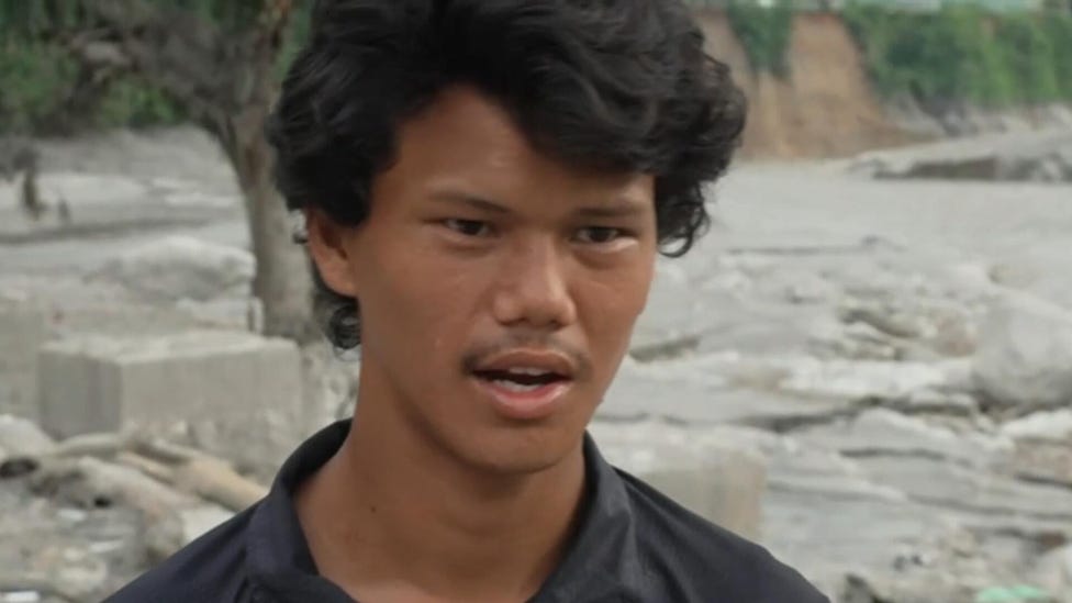 Nepalese man returns to site of his destroyed home after deadly flash flooding