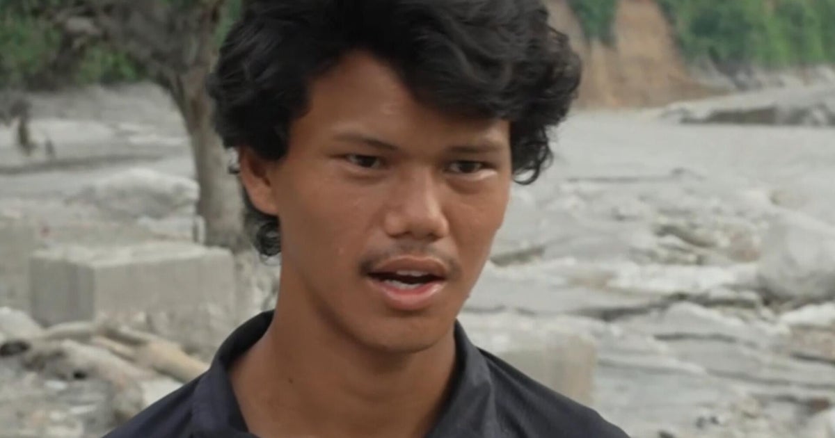 Nepalese man returns to site of his destroyed home after deadly flash flooding