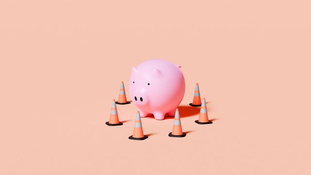 Piggy Bank Surrounded by Traffic Cones 