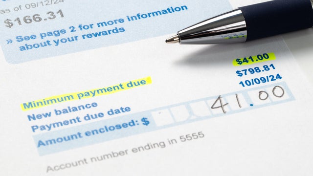 Credit card statement bill showing paying the minimum payment amount 