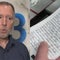 NYPD cop reads through his memo pad he had during 9/11 attacks, now a valued artifact