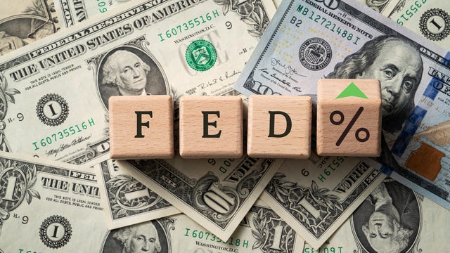 Wooden blocks with interest rate percent of bank with US dollars, financial world economy crisis design concept. 