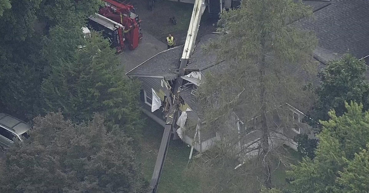Crane topples into home in River Vale, N.J.