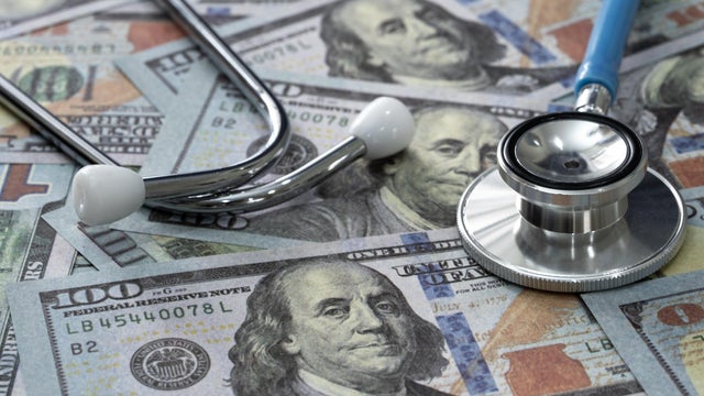 Dollars with stethoscope,Health care or insurance costs concept. Finance banking audit analytics. 