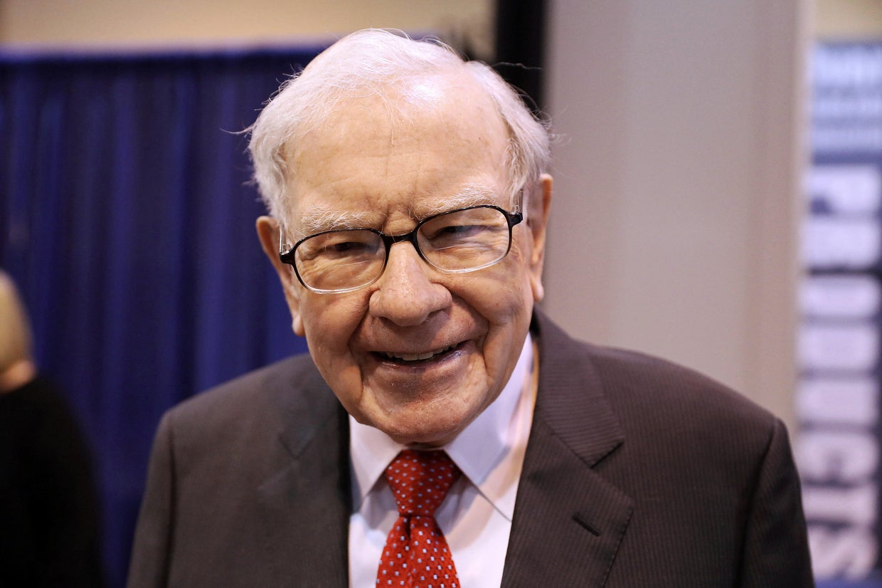 FILE PHOTO: Berkshire Hathaway Chairman Warren Buffett walks through the exhibit hall as shareholders gather to hear from the billionaire investor at Berkshire 