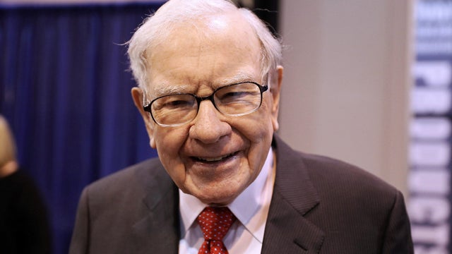 FILE PHOTO: Berkshire Hathaway Chairman Warren Buffett walks through the exhibit hall as shareholders gather to hear from the billionaire investor at Berkshire Hathaway Inc's annual shareholder meeting in Omaha 