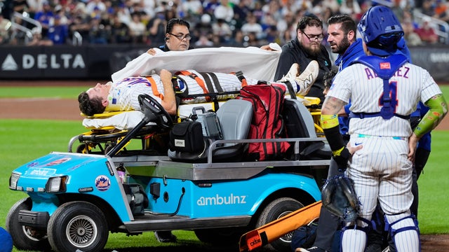 New York Mets first baseman Jared Young is brought off the field on a stretcher after colliding with pitcher Nolan McLean during the sixth inning of a baseball game against the Philadelphia Phillies, Thursday, Sept. 17, 2026, in New York. 