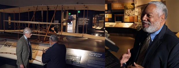 mo-rocca-and-lonnie-bunch-with-the-wright-brothers-plane.jpg