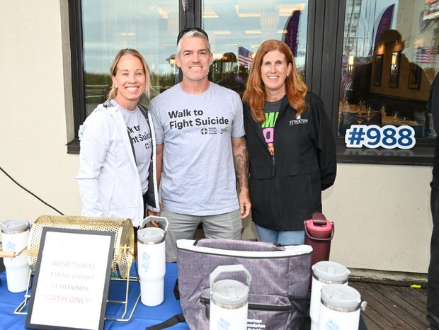 People post for photos at the Out of the Darkness Walk on benefiting the American Foundation for Suicide Prevention