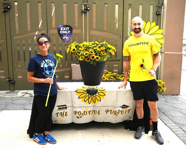 People post for photos at the Out of the Darkness Walk on benefiting the American Foundation for Suicide Prevention