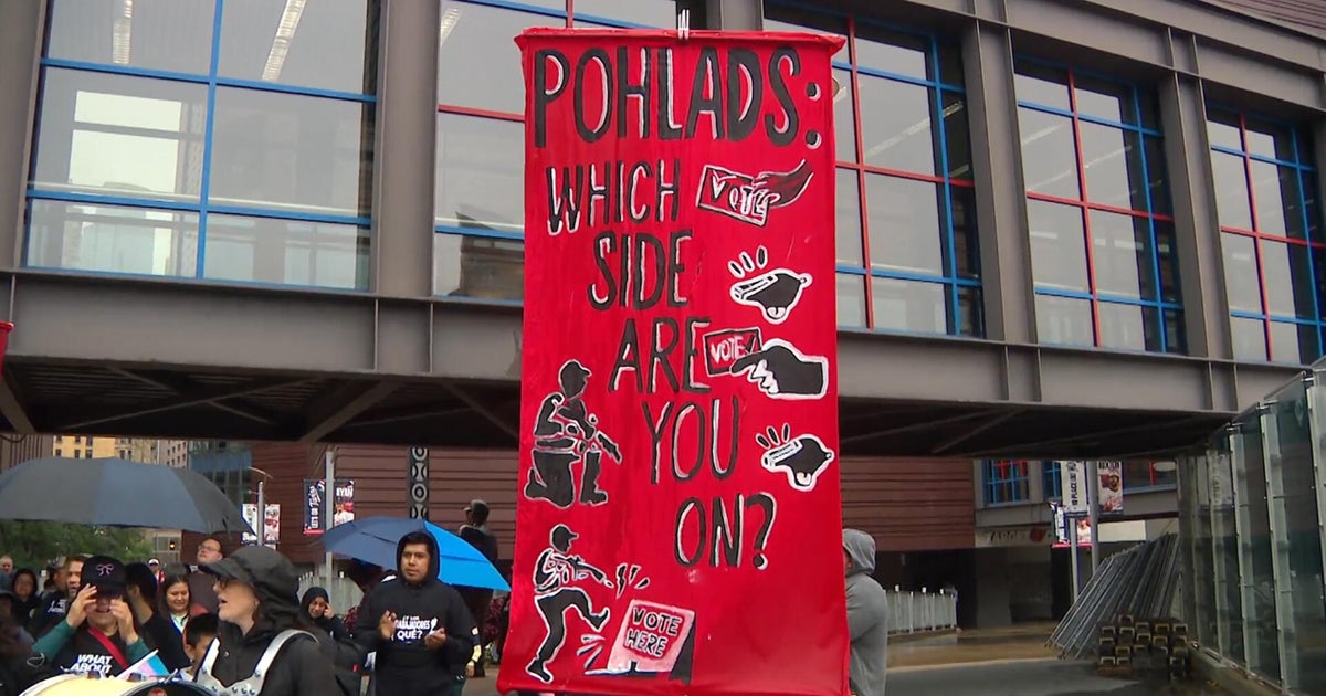 Protesters rally outside Target Field to push Pohland family to “stand up for democracy”