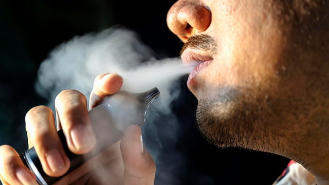 Close-up of man using an electric cigarette 