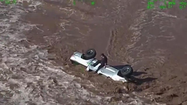Truck swept away in Arizona flooding