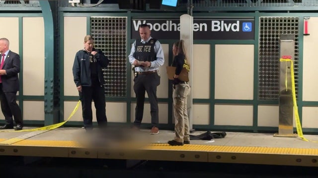 Police on subway station platform investigating 