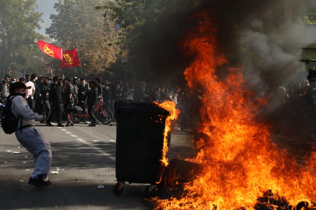 French student protesters clash with riot police near Paris