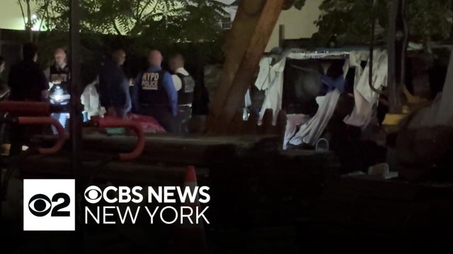 Burned body found in vacant lot in Queens, police sources say