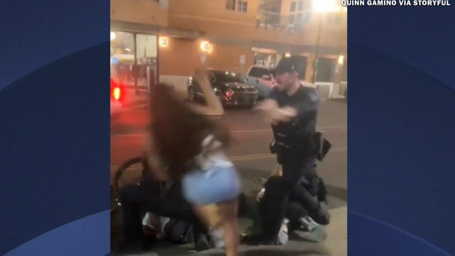 Video shows cheerleader shoved by police