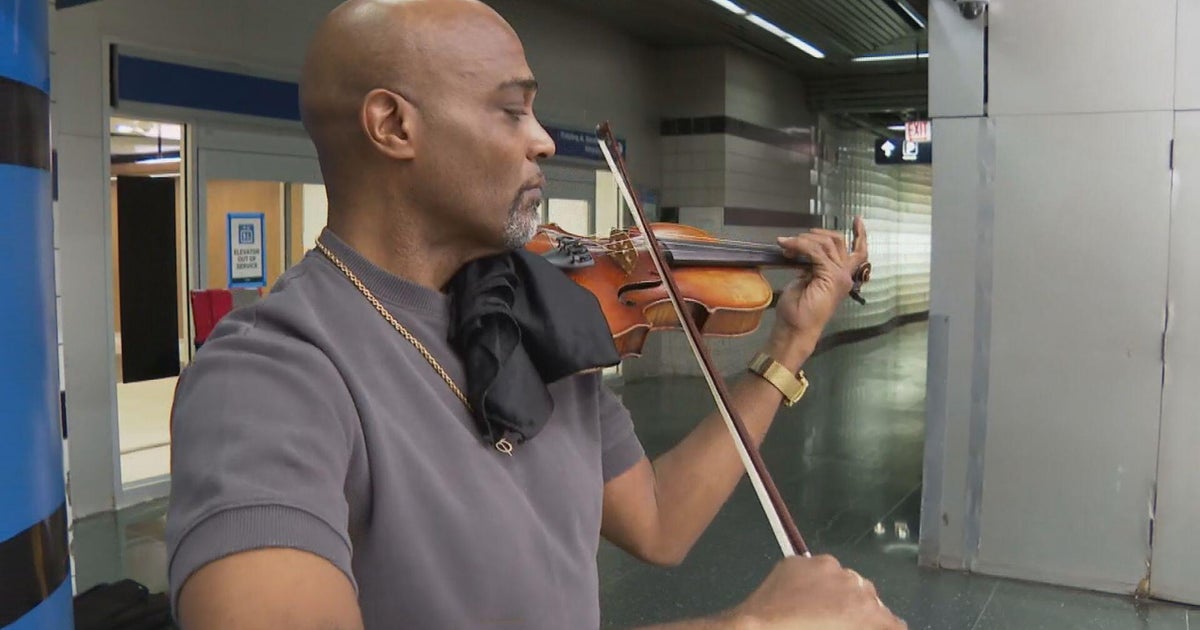 Violinist Samuel Williams holds mini concerts for travelers passing through O'Hare Airport