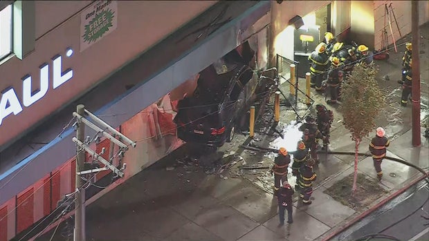 1 deaad after car crashes into U-Haul building in Kensington, sparking large fire