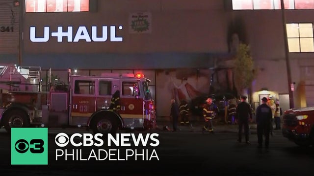 1 dead after car crashes into U-Haul facility in Kensington, sparking large fire, police say