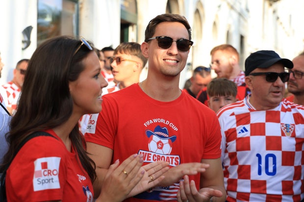 Ashton and Zachary Smith gather with Croatian supporters before a match in Split, Croatia