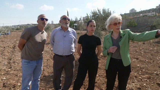 Lesley Stahl with a family in the West Bank 