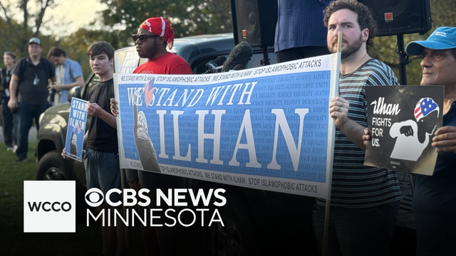 Supporters of Rep. Ilhan Omar rally in Minneapolis after feds search her home