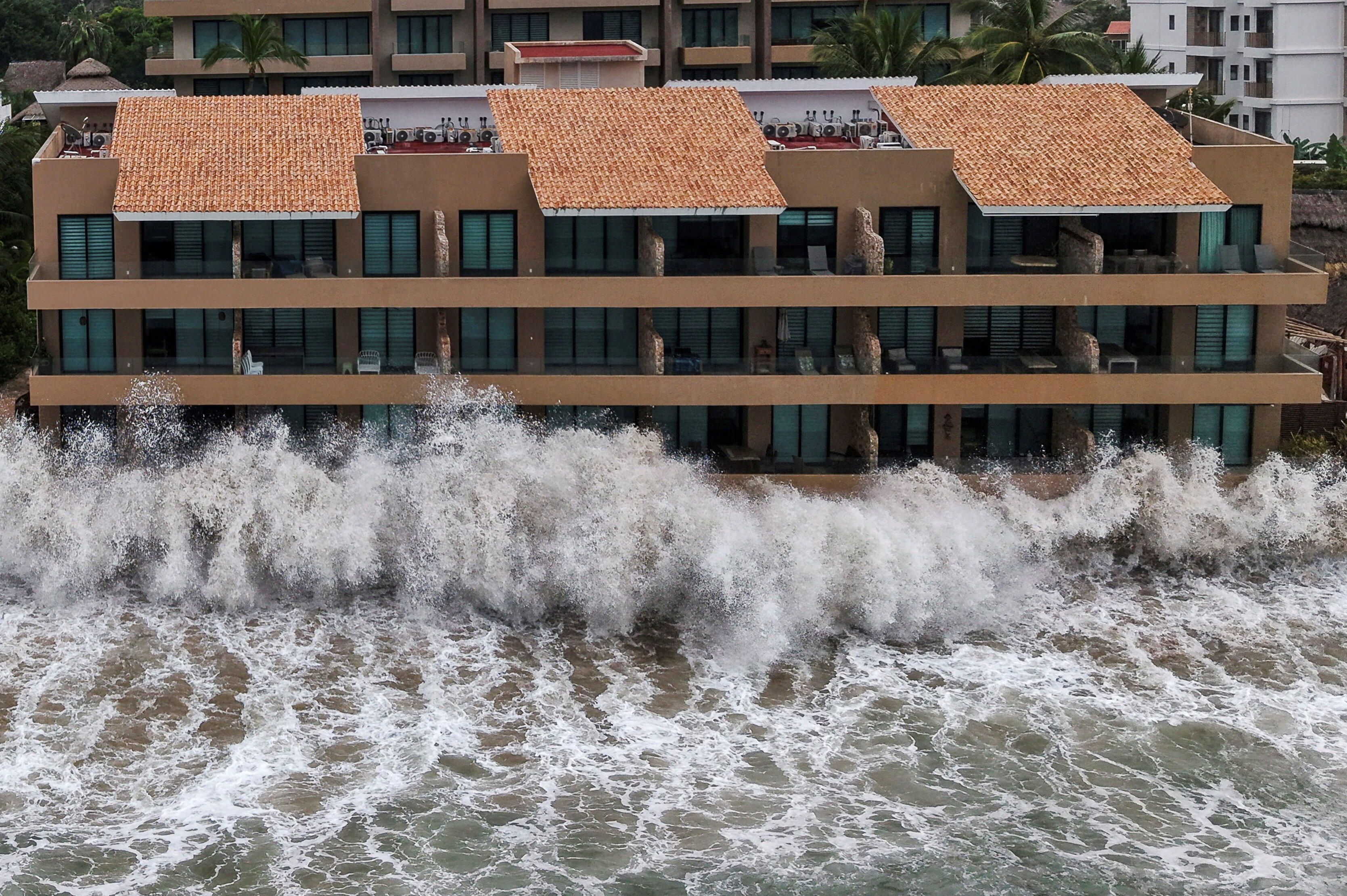 Hurricane Simon hits western Mexico after storms kill 5