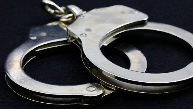 Police handcuffs on black background 